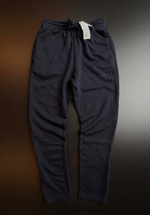 Navy blue Adidas joggers in size S, featuring a relaxed fit and elastic waistband, displayed against a neutral background.