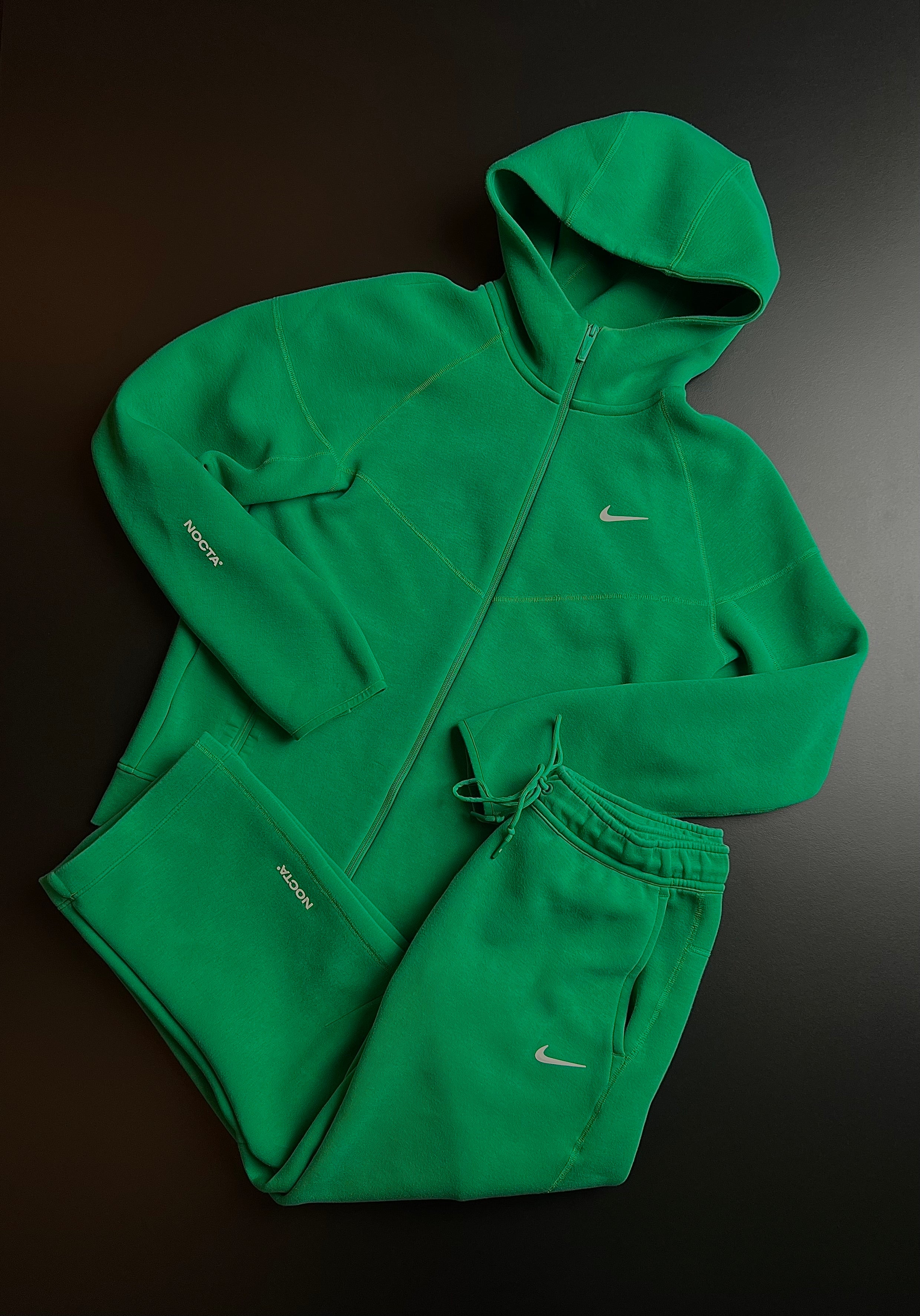 Nike NOCTA green tracksuit in size M displayed on a mannequin, showcasing its stylish design and vintage appeal.