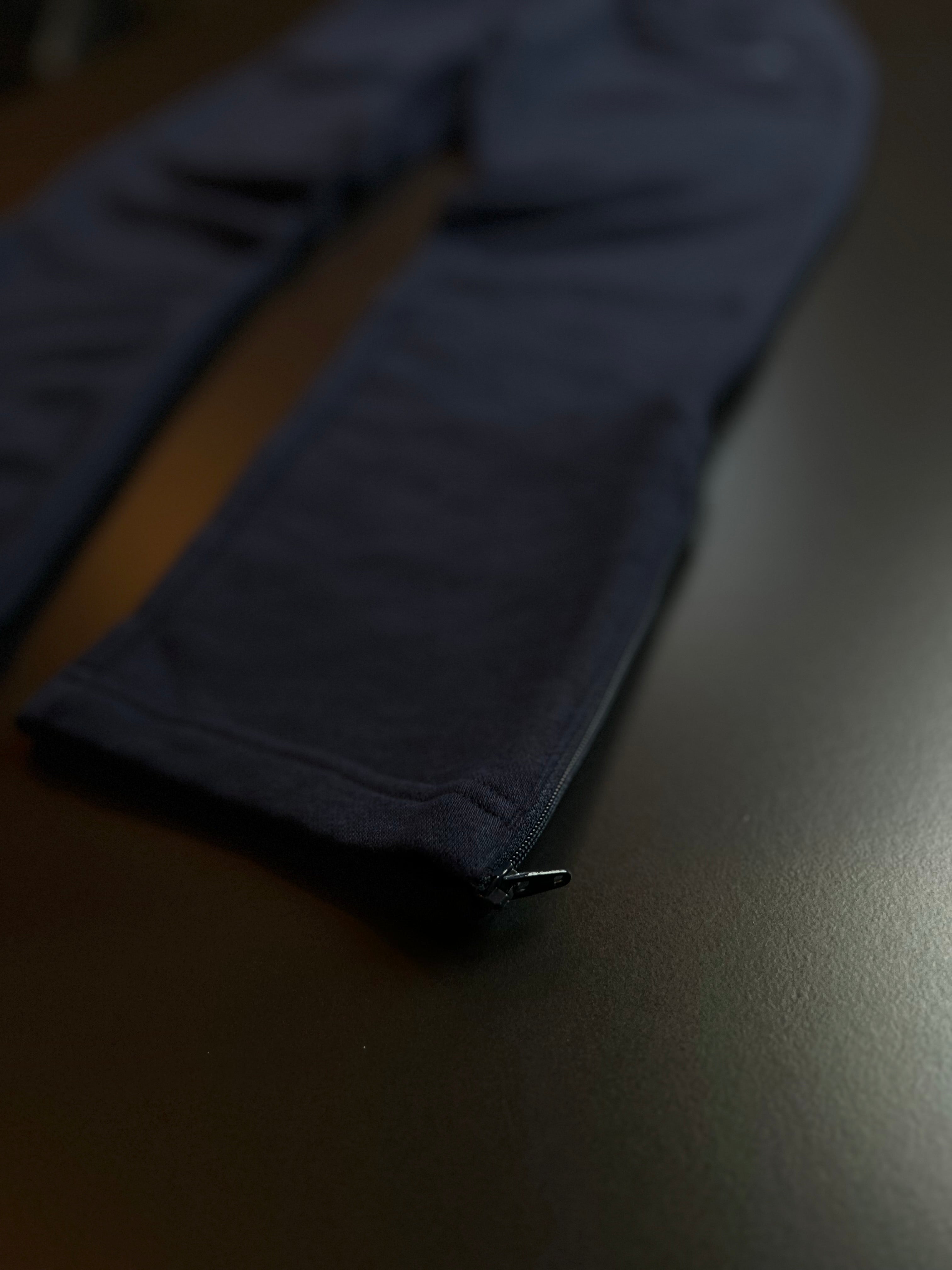 Navy blue Adidas joggers in size S, featuring a relaxed fit and classic design, displayed on a neutral background.