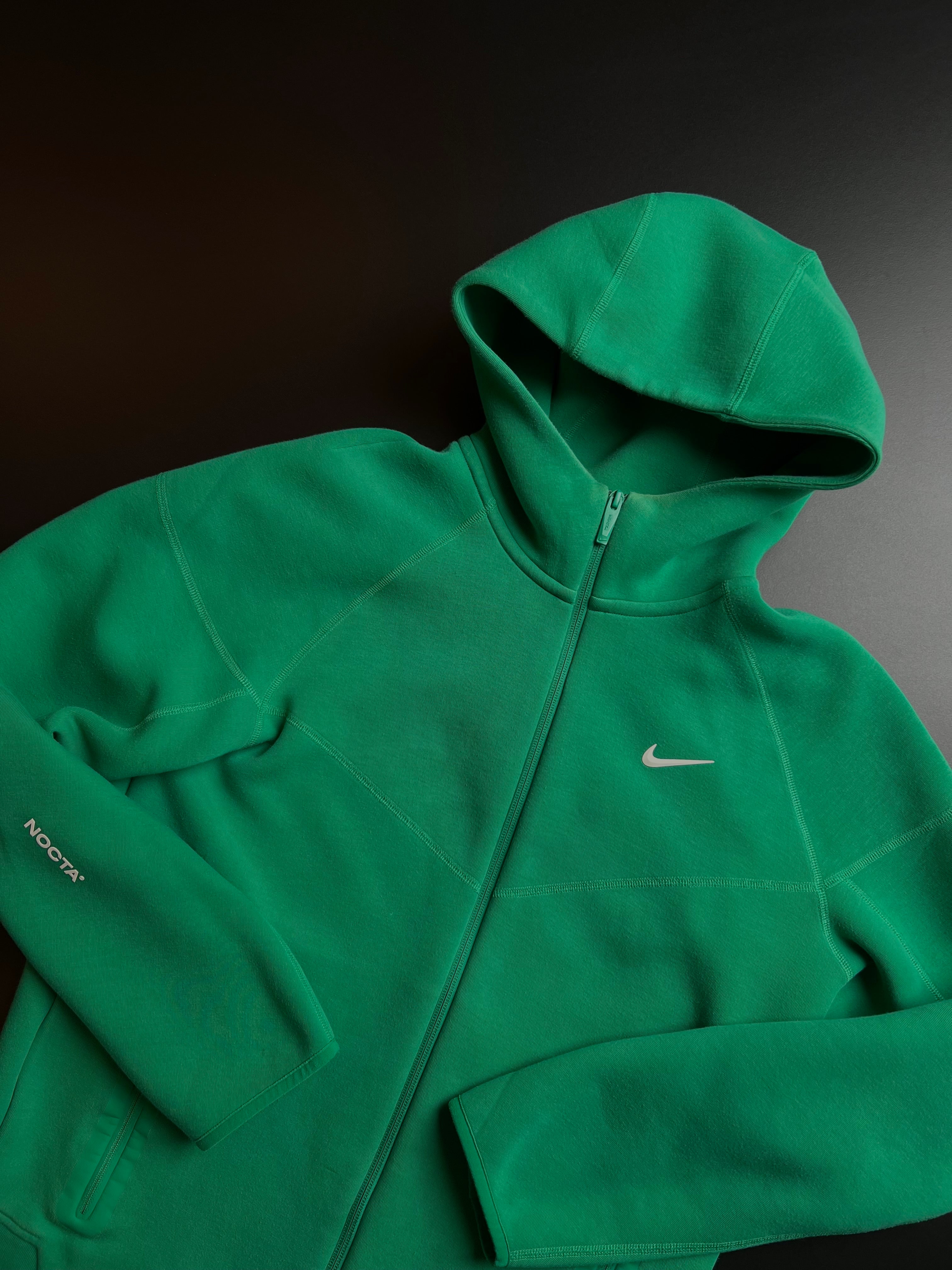 Nike NOCTA green tracksuit in size M, featuring a sporty design and vintage KM Timless branding.