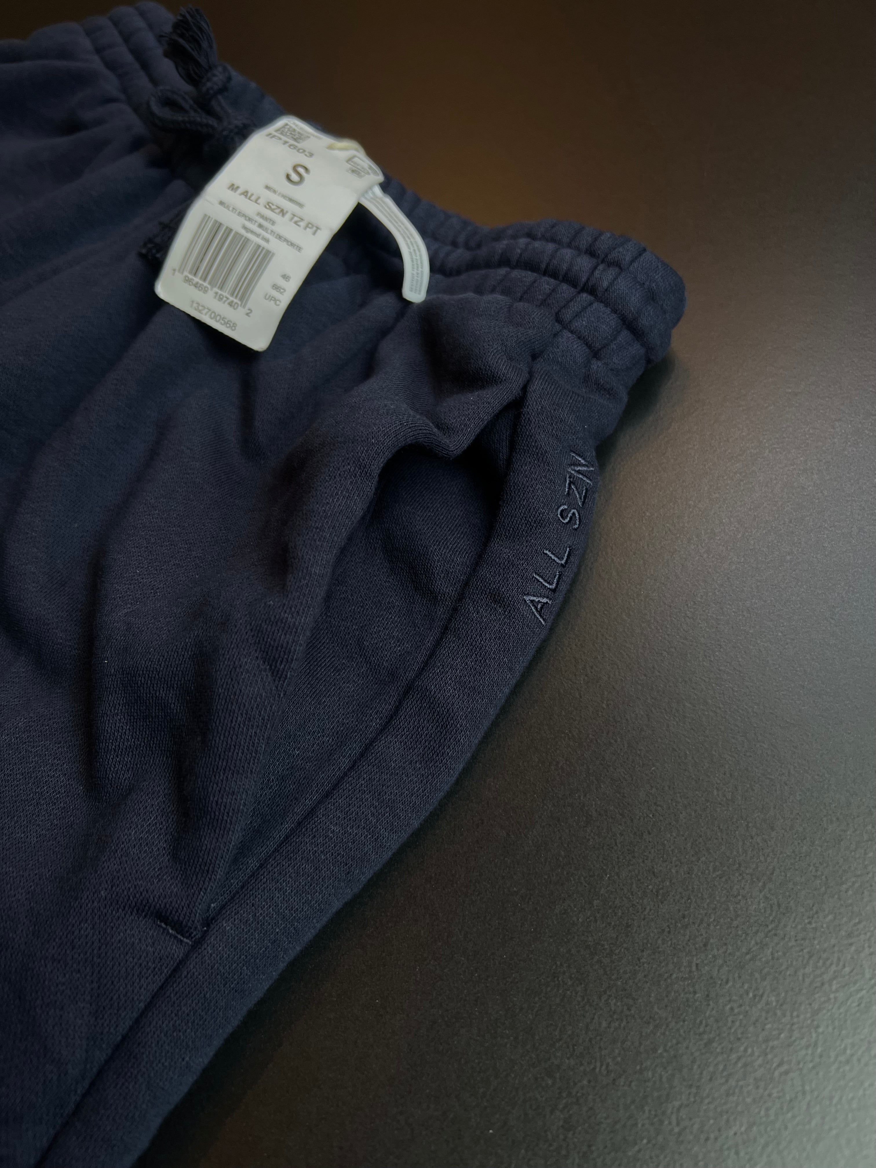 Navy blue Adidas joggers in size S, featuring a comfortable fit and classic design by KM Timless Vintage.