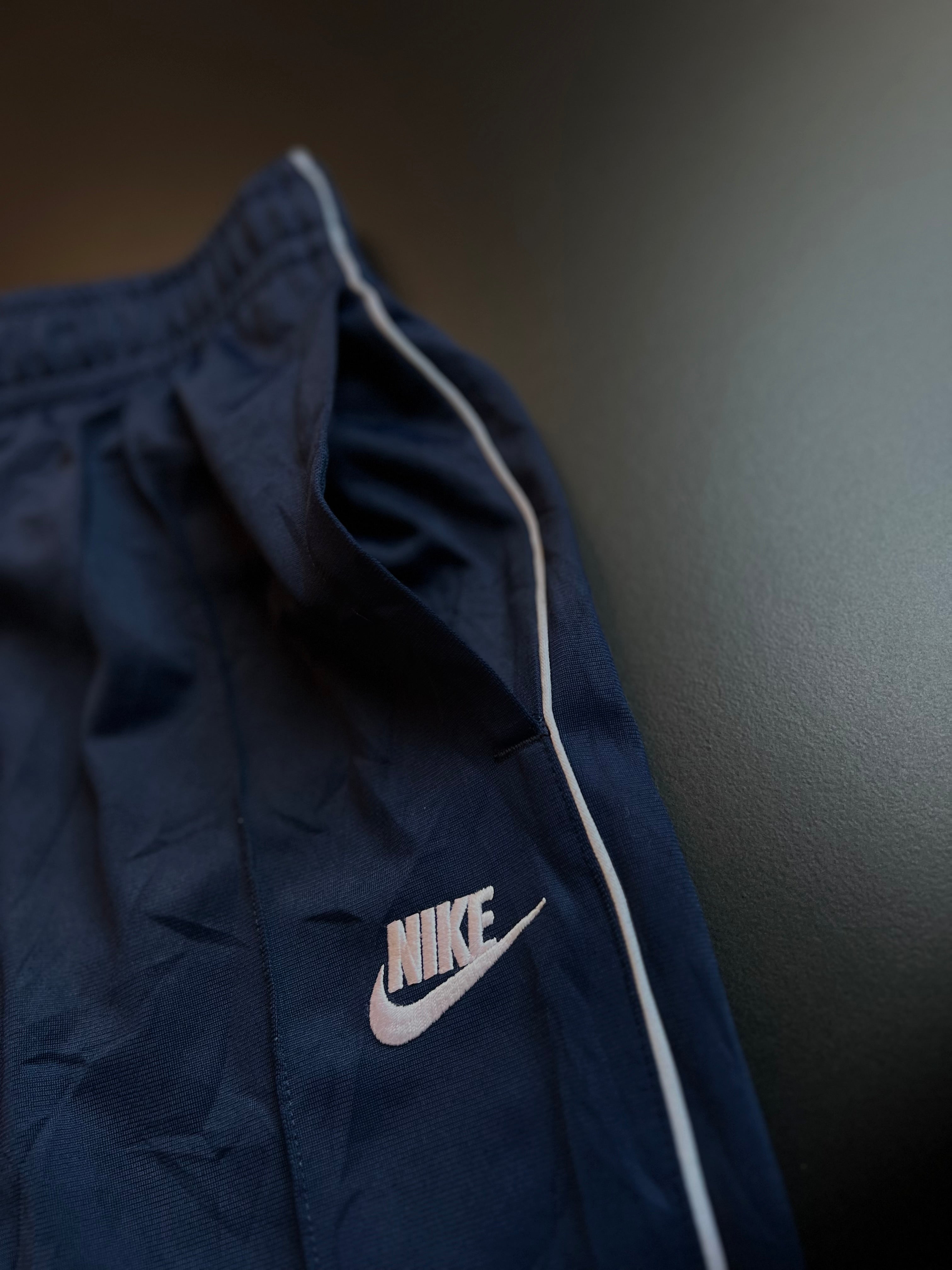 Nike Track Trousers | Navy | White Swoosh Side Stripe | S