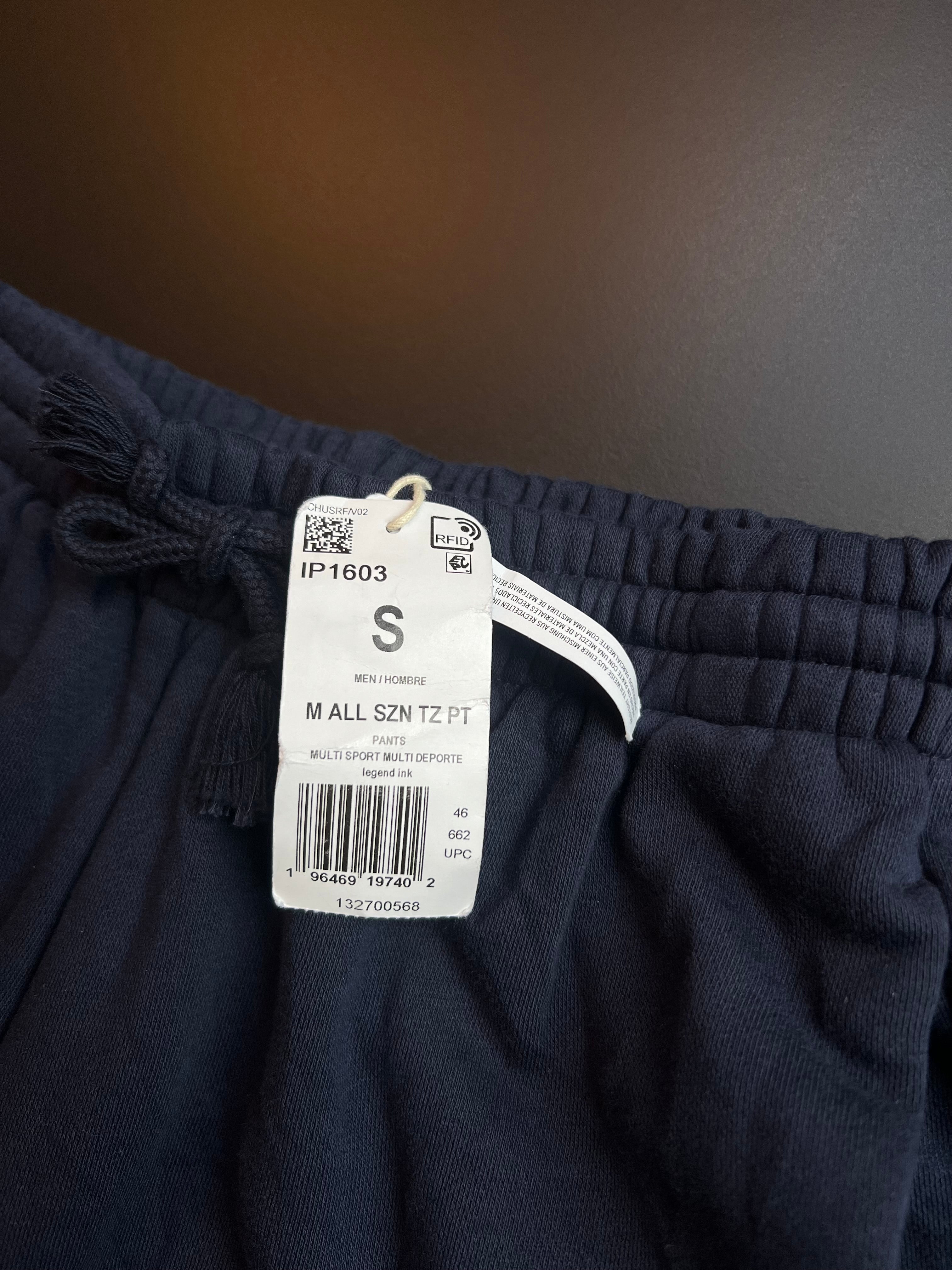 Navy blue Adidas joggers in size S with a comfortable fit, featuring a sporty design and soft fabric.