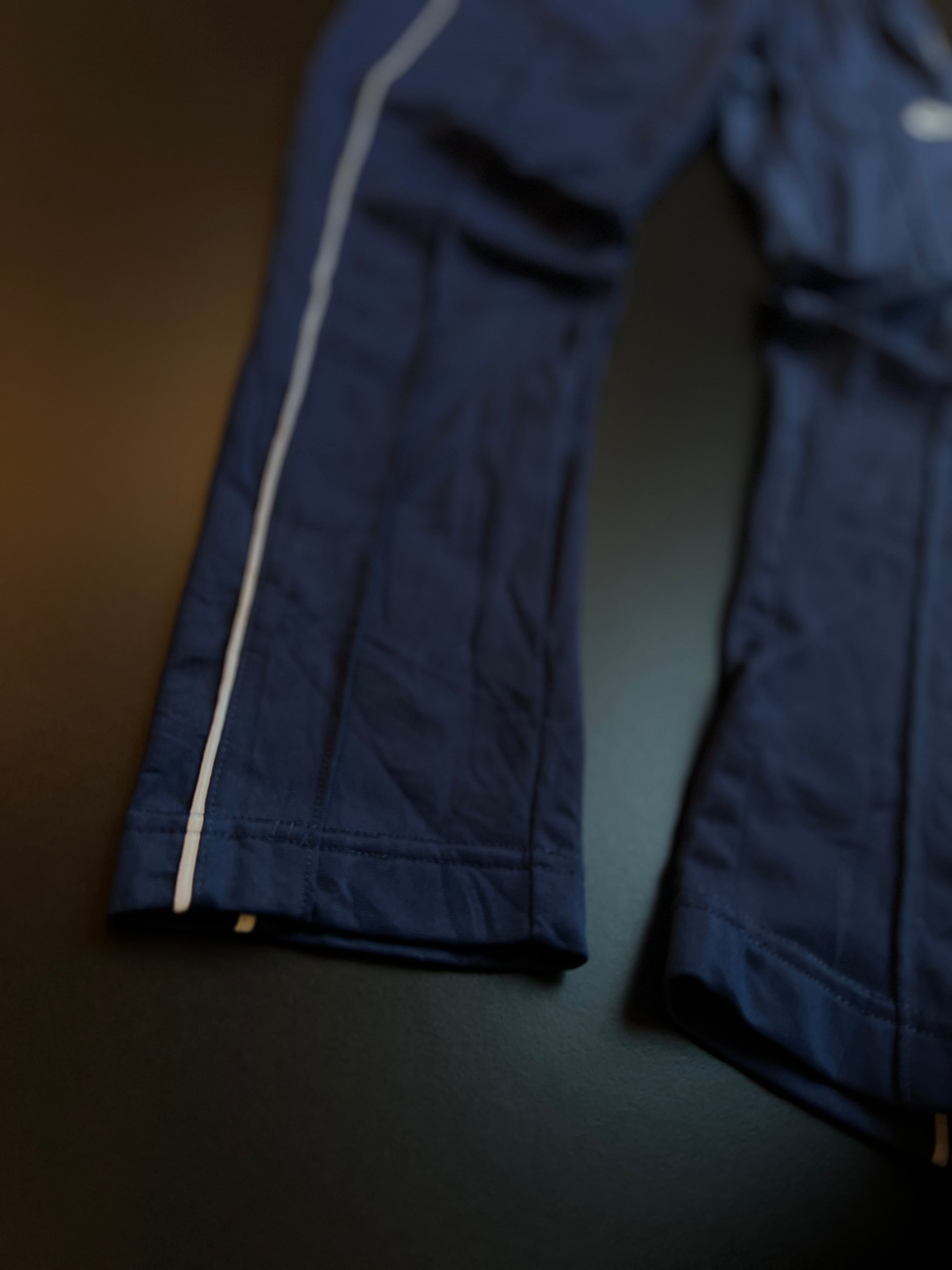 Nike Track Trousers | Navy | White Swoosh Side Stripe | S