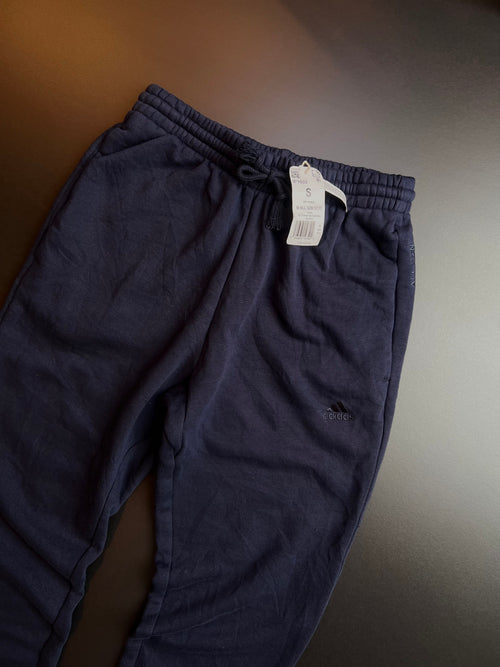 Navy blue Adidas joggers in size S, featuring a comfortable fit and classic design from KM Timeless Vintage.