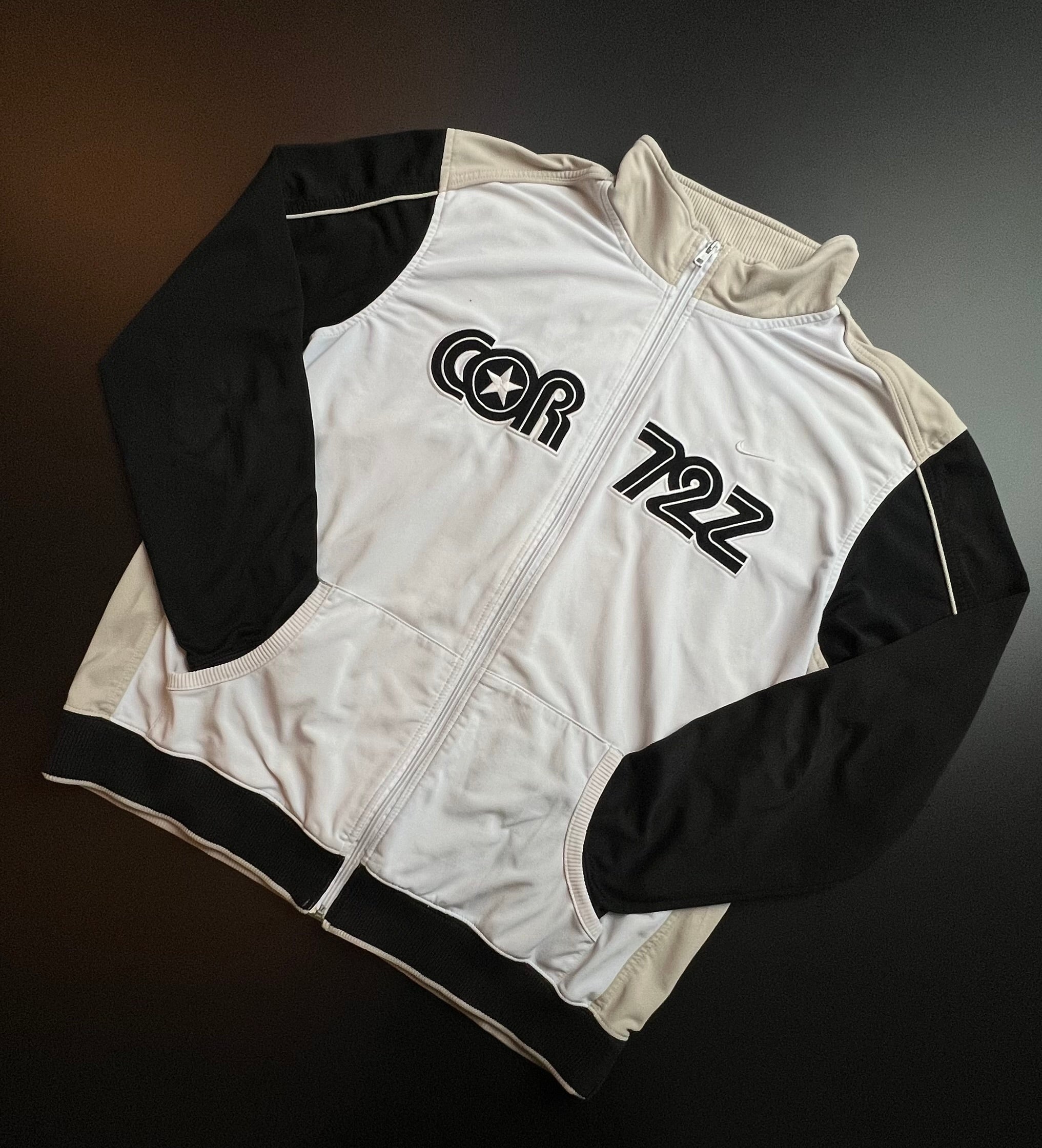 Beige and black Nike × Corteiz track jacket in XL, featuring a streetwear style and unique collaboration design.