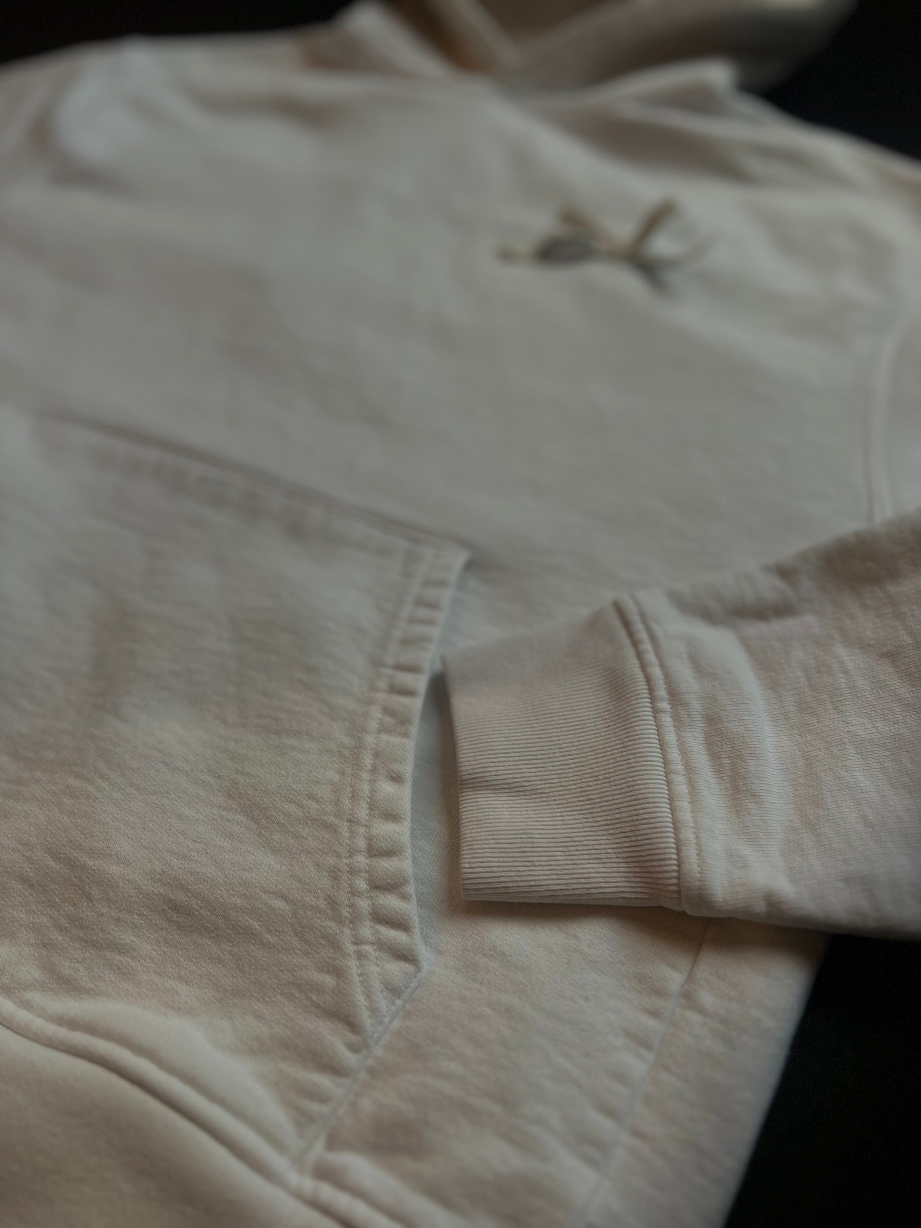 Cream white Jacquemus hoodie in size M, featuring a minimalist design and soft fabric texture on a neutral background.