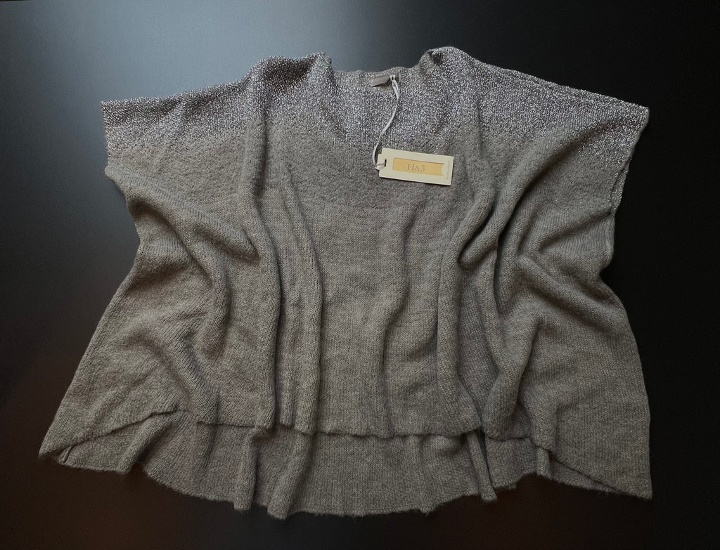 Grey H&3 knit jumper by KM Timeless Vintage, displayed on a hanger with soft texture and relaxed fit, made in Italy.