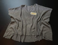 Grey H&3 knit jumper by KM Timeless Vintage, displayed on a hanger with soft texture and relaxed fit, made in Italy.