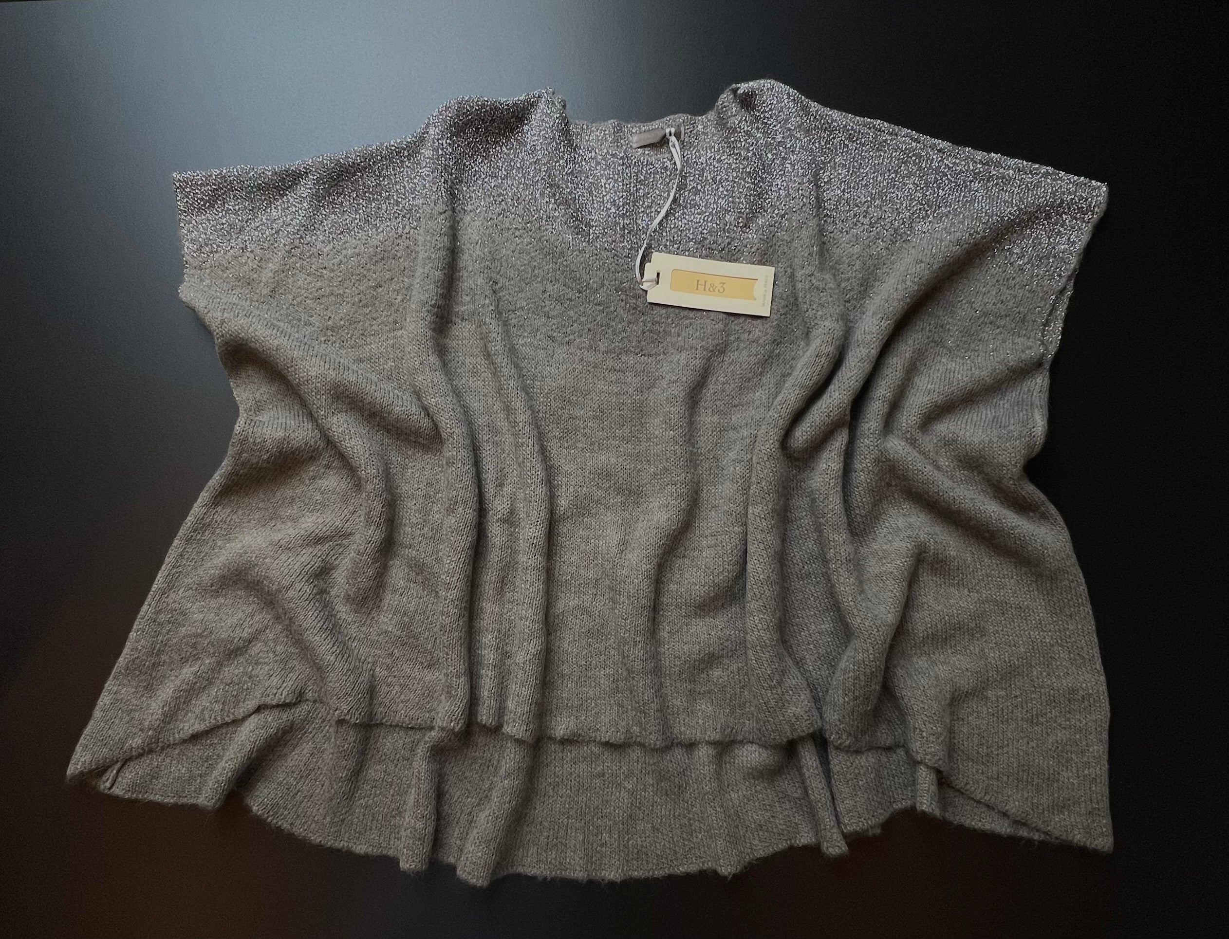 Grey H&3 knit jumper by KM Timeless Vintage, displayed on a hanger with soft texture and relaxed fit, made in Italy.