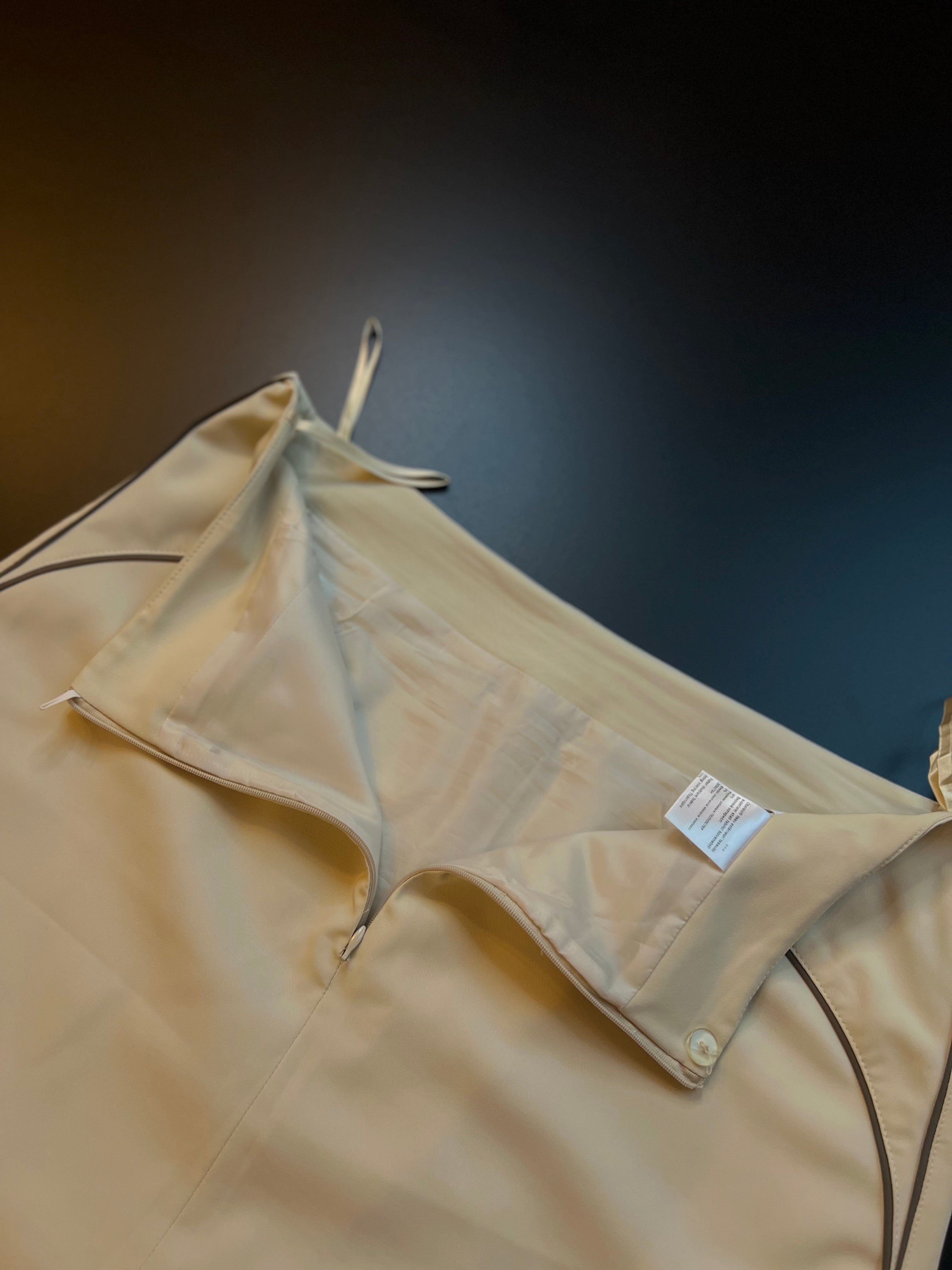 Beige Alba Moda skirt size 44, featuring a classic design, drapes elegantly on a neutral background.